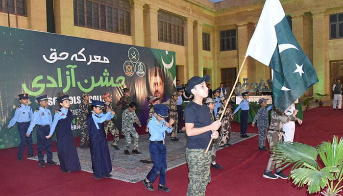School students performance during Marka E Haq, Independence Celebrations at Governor House. — APP