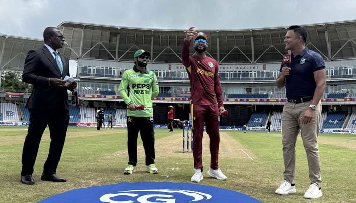 West Indies captain Shai Hope (second from right) flips the coin as Pakistans Mohammad Rizwan (second from left) looks on at the toss for their first ODI at the Brian Lara Stadium in Tarouba on August 8, 2025. — Cricket West Indies