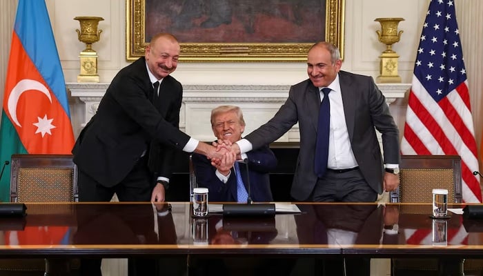 U.S. President Donald Trump holds the hands of Azerbaijans President Ilham Aliyev and Armenias Prime Minister Nikol Pashinyan at the White House, August 8, 2025. —Reuters