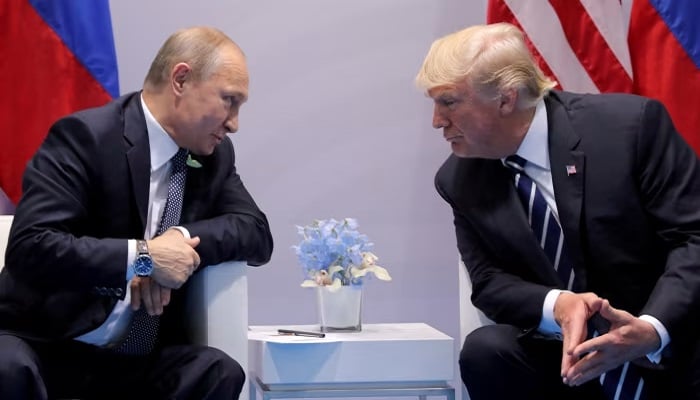 Russias President Vladimir Putin talks to US President Donald Trump during their bilateral meeting at the G20 summit in Hamburg, Germany. —Reuters/File