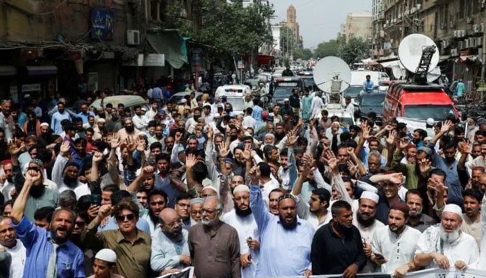 People protest in Karachi on August 18, 2023. — Reuters