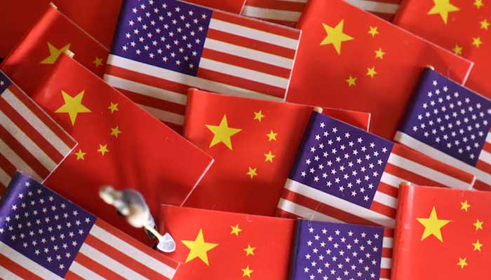China and US flags are displayed alongside a miniature worker in this illustration picture taken November 7, 2024. — Reuters