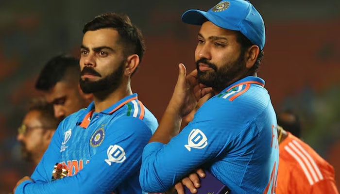 Indias Virat Kohli (left) and Rohit Sharma look dejected after losing the ICC Cricket World Cup final at Narendra Modi Stadium, Ahmedabad, India on November 19, 2023.  Reuters