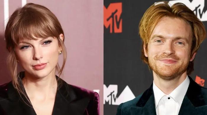 Finneas and Taylor Swift at a birthday party