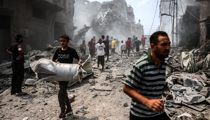 The image shows commotion after a strike from Israel. — Reuters/File
