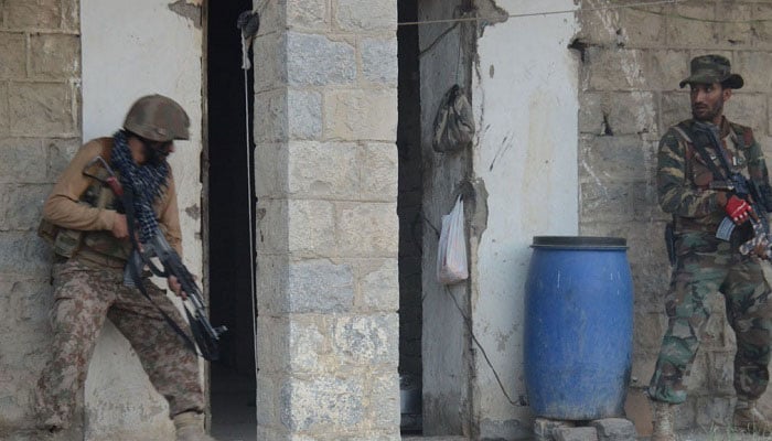 Security forces personnel take part in an anti-terror operation at a compound. — ISPR/File