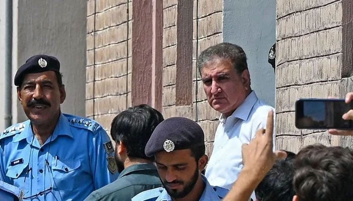 Shah Mahmood Qureshi, a leader from the PTI, is seen outside a special court after he was granted a four-day physical remand in Islamabad on August 21, 2023. — AFP