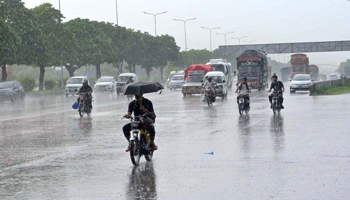 Commuters face hurdles during heavy rain on the Islamabad Expressway on July 8, 2025. — APP