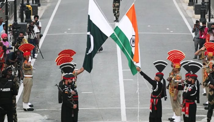 Pakistan Rangers and Indias BSF personnel pictured during the flag lowering ceremony at the Wagah Border crossing. — Reuters/File