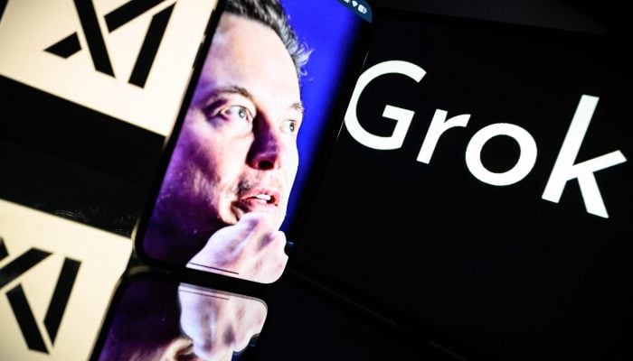 This photograph taken on January 13, 2025 in Toulouse shows screens displaying the logo of Grok, a generative artificial intelligence chatbot developed by xAI, and its founder South African businessman Elon Musk. — AFP