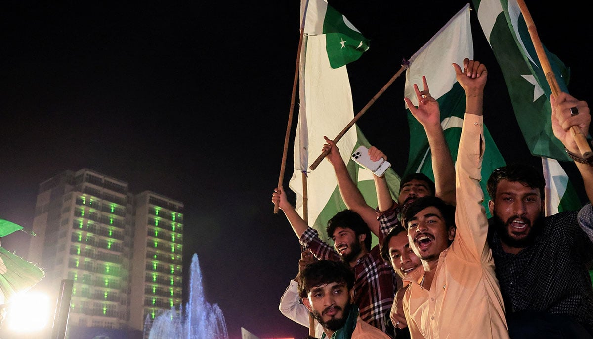 People chant slogans during Independence Day celebration in Lahore on August 14, 2025. — Reuters
