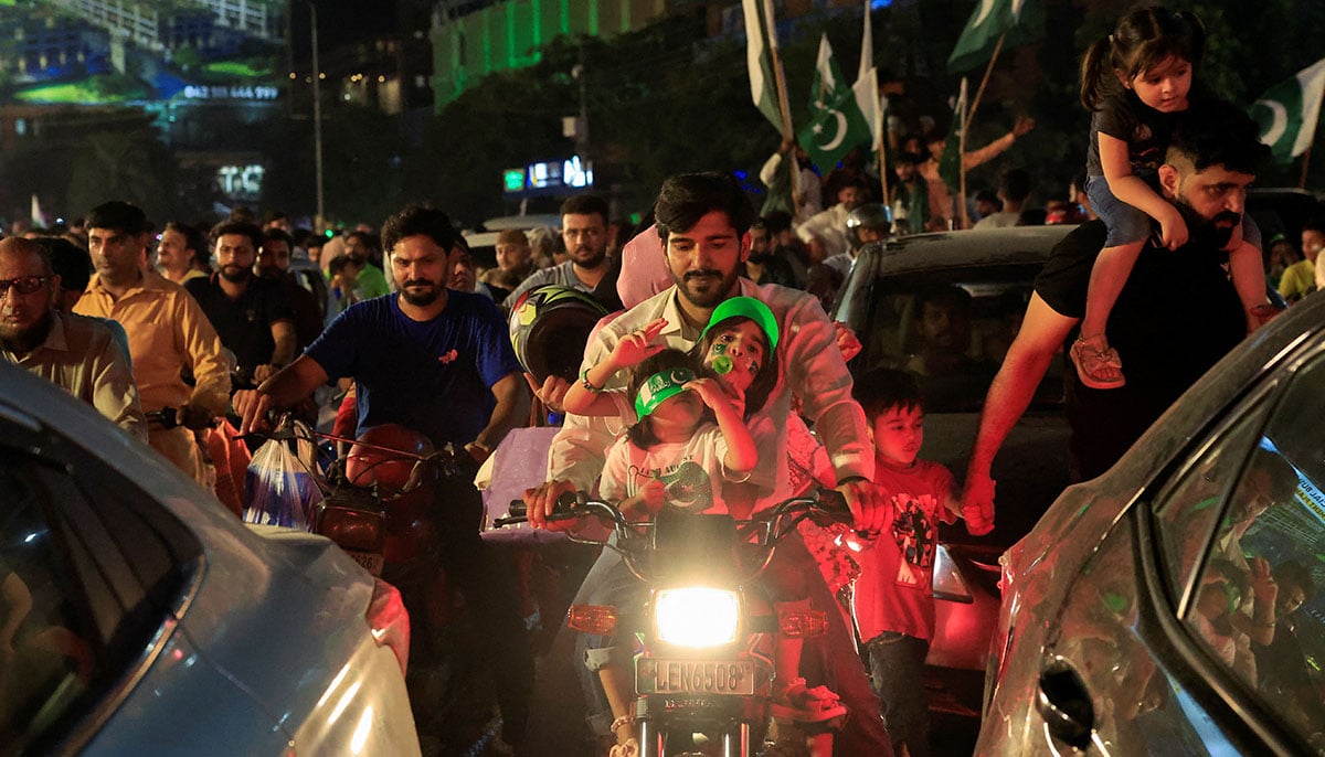 People take part in Independence Day celebration in Lahore on August 14, 2025. — Reuters