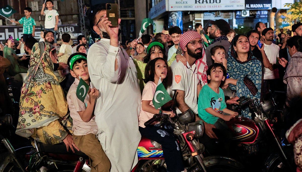 People watch fireworks during Independence Day celebration in Lahore on August 14, 2025. — Reuters