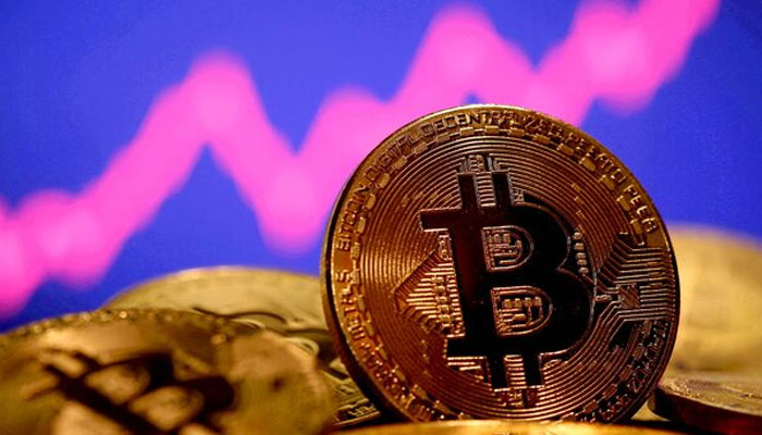 A representation of virtual currency Bitcoin is seen in front of a stock graph in this illustration taken January 8, 2021. — Reuters