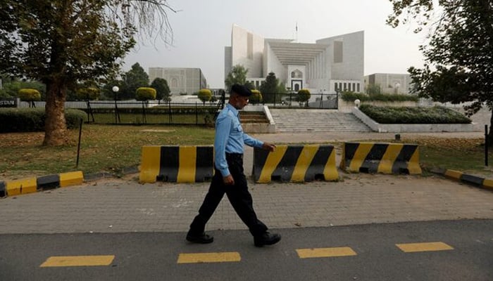 A policeman walks past the Supreme Court building in Islamabad, Pakistan October 31, 2018. — Reuters