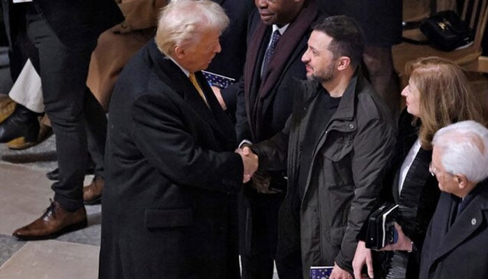 US President-elect Donald Trump and Ukrainian President Volodymyr Zelensky shake hands inside the Notre-Dame de Paris Cathedral ahead of a ceremony to mark its re-opening following the 2019 fire, in Paris, France, December 7, 2024.   — Reuters