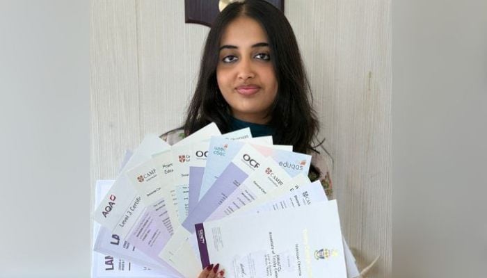 Mahnoor Cheema, an 18-year-old British-Pakistani student with her examination results. — Reporter