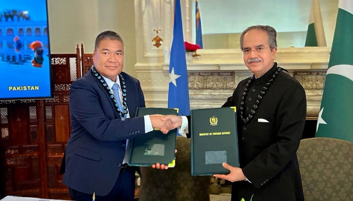 Pakistans Ambassador to the United Nations Asim Iftikhar (right) and Ambassador Jeem S Lippwe sign a joint communiqué to formalise relationship between the two countries on August 14, 2025. — X/@PakistanUN_NY