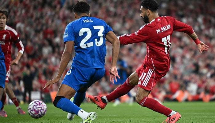 Liverpools Egyptian striker #11 Mohamed Salah (R) scores their fourth goal during the English Premier League football match between Liverpool and Bournemouth at Anfield in Liverpool, north west England on August 15, 2025. — AFP
