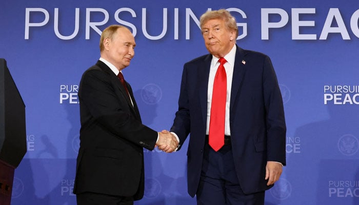US President Donald Trump and Russian President Vladimir Putin shake hands during a press conference following their meeting to negotiate an end to the war in Ukraine, at Joint Base Elmendorf-Richardson, in Anchorage, Alaska, August 15, 2025. — Reuters
