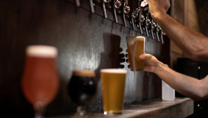 Beer is poured from a tap at a brewery in Oceanside, California, US, October 15, 2020. — Reuters