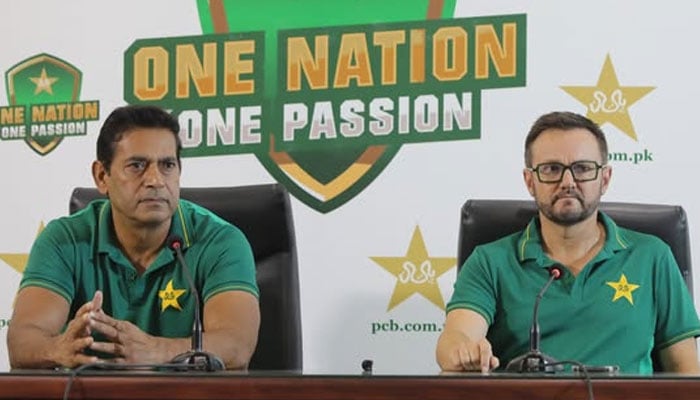 PCBs Director High Performance Aqib Javed (left) speaks during a press conference alongside Pakistans white-ball head coach Mike Hesson as they announce Green Shirts squad for Asia Cup, UAE tri-series on August 17, 2025. — Facebook@PakistanCricketBoard