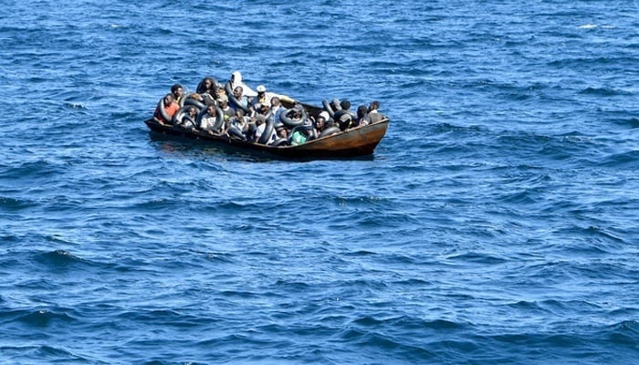 This representational image shows a boat carrying migrants. — AFP/File