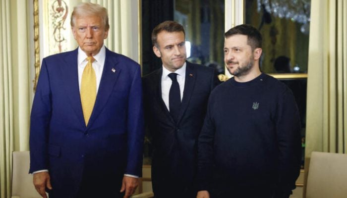 French President Emmanuel Macron meets US president-elect Donald Trump and Ukraines President Volodymyr Zelensky at the Elysee presidential palace in Paris on December 7, 2024. — AFP