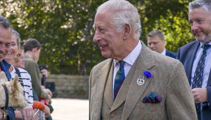 King Charles greets tourists outside Balmoral Castle in Scotland