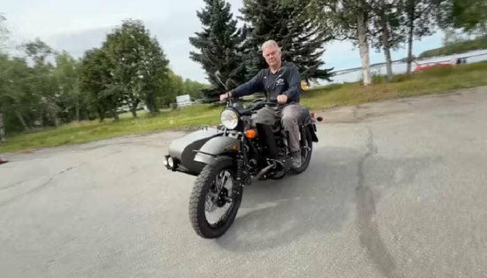 Alaska resident Mark Warren rides his new Ural motorcycle, a gift from Russian President Vladimir Putin, handed over by a Russian Embassy official, in Anchorage, Alaska, U.S., in this still image from video released August 18, 2025.— Reuters