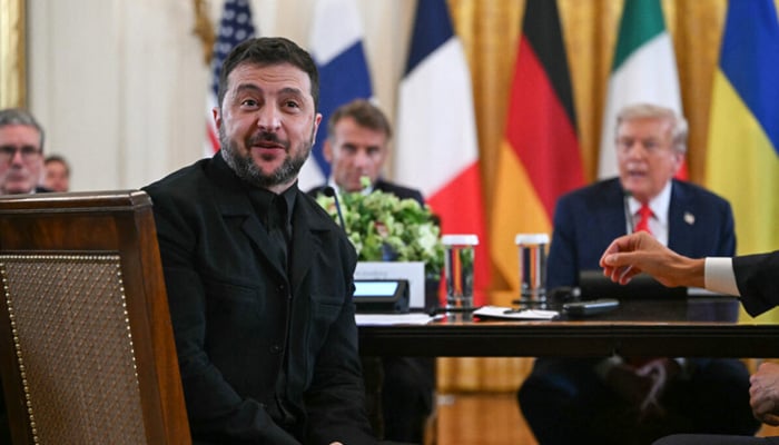French President Emmanuel Macron (2L) and US President Donald Trump (R) listen to Ukrainian President Volodymyr Zelensky speak during a meeting with European leaders in the East Room of the White House in Washington, DC, on August 18, 2025. — AFP