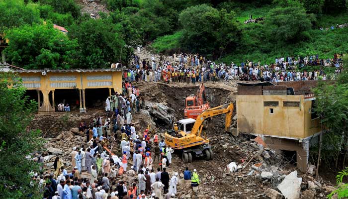 Residents gather as rescue workers look for victims, following a storm that caused heavy rains and flooding in Dalori Bala village in Gadoon district in Khyber Pakhtunkhwa province, Pakistan, August 19, 2025. — Reuters