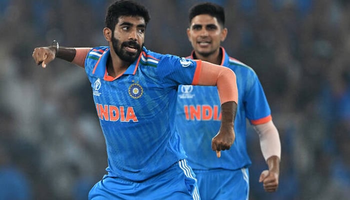 Indias Jasprit Bumrah (L) celebrates with teammate Shubman Gill after taking the wicket of Australias Mitchell Marsh during the 2023 ICC Mens Cricket World Cup one-day international (ODI) final match between India and Australia at the Narendra Modi Stadium in Ahmedabad on November 19, 2023. — AFP