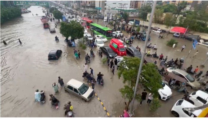 Cars stranded on the road after heavy rains submerged roads in Karachi on August 19, 2025. — Geo News