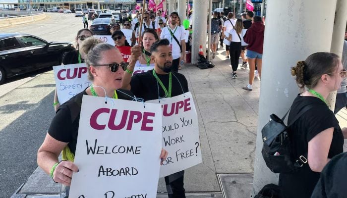 Demonstrators holds placards, as Air Canada flight attendants said they will remain on strike and challenge a return-to-work order they called unconstitutional, defying a government decision to force them back to their duties, at Toronto Pearson International Airport in Mississauga, Ontario, Canada August 17, 2025. — Reuters