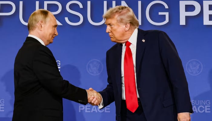 US President Donald Trump and Russian President Vladimir Putin shake hands in Anchorage, Alaska, August 15, 2025.  Reuters
