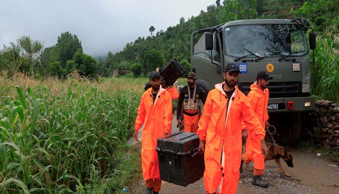 Army soldiers, members of the Urban Search and Rescue team carry rescue equipment as they walk towards the damaged area, following a storm that caused heavy rains and flooding in Bayshonai Kalay, in Buner district, in Khyber Pakhtunkhwa province, August 18, 2025. — Reuters
