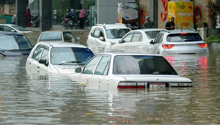 Partially submerged vehicles move, as some are parked, after the monsoon rain in Karachi, Pakistan, August 19, 2025. — Reuters