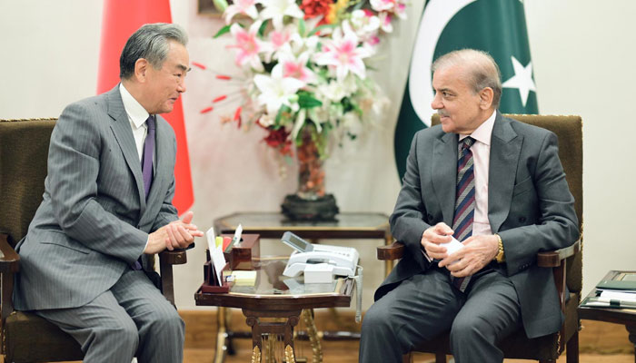 Chinese Foreign Minister Wang Yi (left) calls on Prime Minister Shehbaz Sharif in Islamabad on August 21, 2025. — PID