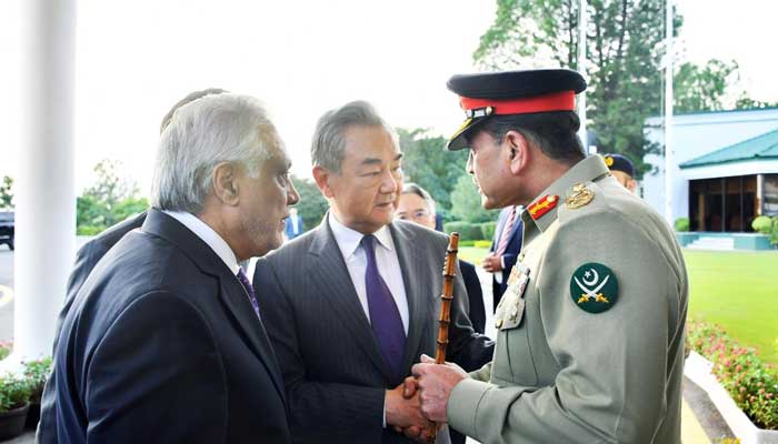 Chief of Army Staff Field Marshal Asim Munir (right) shakes hand with Chinese Foreign Minister Wang Yi in Islamabad on August 22, 2025. — ISPR