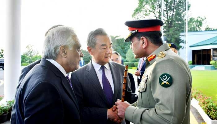 Chief of Army Staff Field Marshal Asim Munir (right) shakes hand with Chinese Foreign Minister Wang Yi in Islamabad on August 22, 2025. — ISPR