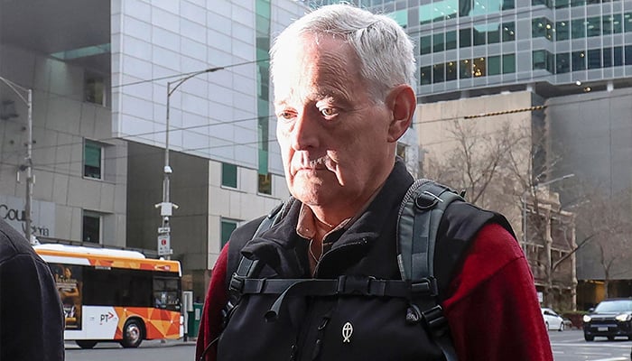 Ian Wilkinson, the only guest to survive a toxic mushroom lunch with Australian murderer Erin Patterson, leaves the Supreme Court of Victoria following the days proceedings in a pre-sentencing hearing in Melbourne on August 25, 2025. — AFP