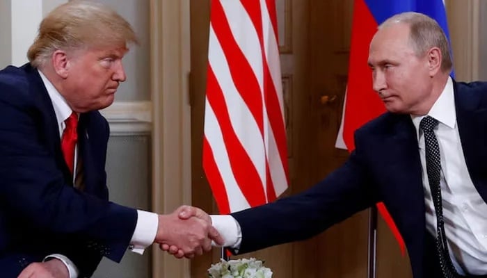 US President Donald Trump and Russian President Vladimir Putin shake hands as they meet in Helsinki, Finland, July 16, 2018. — Reuters
