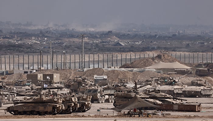 Military vehicles stand on the Israeli side of the border with Gaza, in Israel August 25, 2025. — Reuters