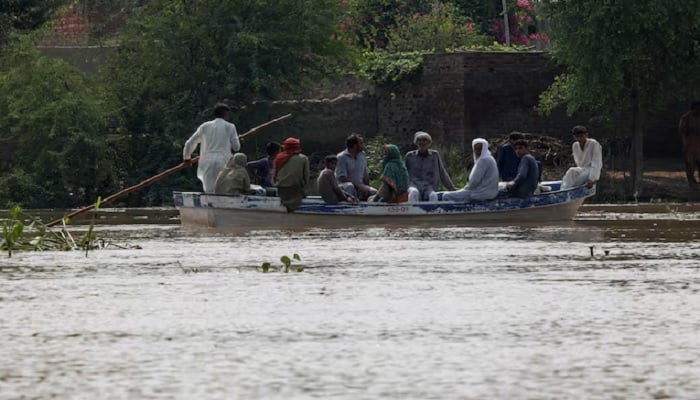 Residents use a boat to reach their destination in flooded areas due to the monsoon rains and rising water level of the Sutlej River, in Hakuwala village near the Pakistan-India border in Kasur district of the Punjab province, Pakistan August 23, 2025. —Reuters