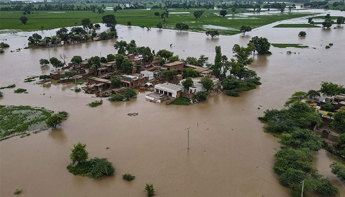 This aerial photograph shows partially submerged houses in the flood-affected area of Haqu Wala village in Kasur district on August 24, 2025. — AFP
