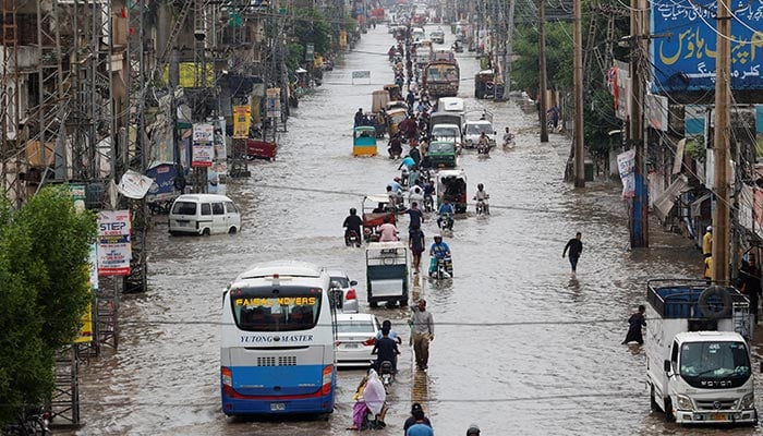 Vehicles move along a flooded road following monsoon rains and rising water levels in Sialkot, on August 27, 2025. — Reuters