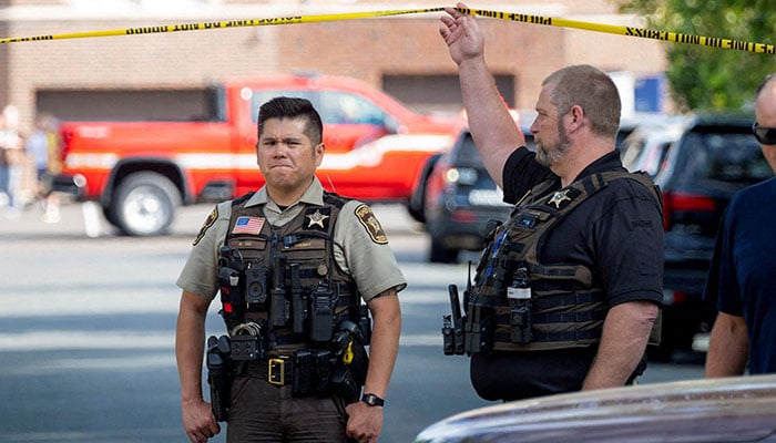 An officer with the Hennepin County Sheriff looks on outside a shooting at Annunciation Church, which is also home to an elementary school, in Minneapolis, Minnesota, US, August 27, 2025. — Reuters