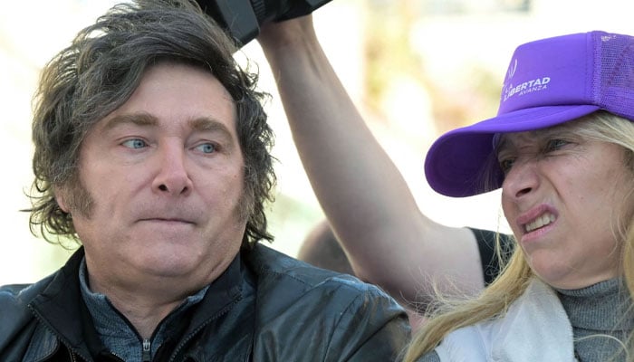 Argentina´s President Javier Milei (left) and his sister, Secretary General of the Presidency Karina Milei, lead a motorcade during a rally ahead of legislative provincial elections in Lomas de Zamora, Buenos Aires province, Argentina, on August 27, 2025.— AFP
