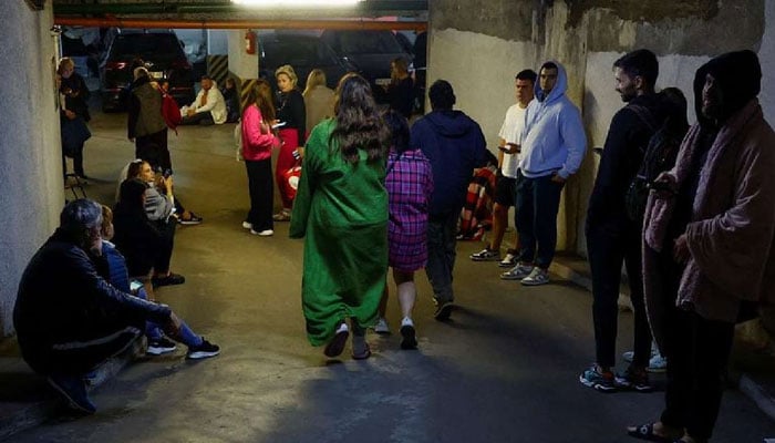 People take shelter inside an underground parking during Russian drone and missile strike, amid Russias attack on Ukraine, in Kyiv, Ukraine on August 28, 2025. — Reuters